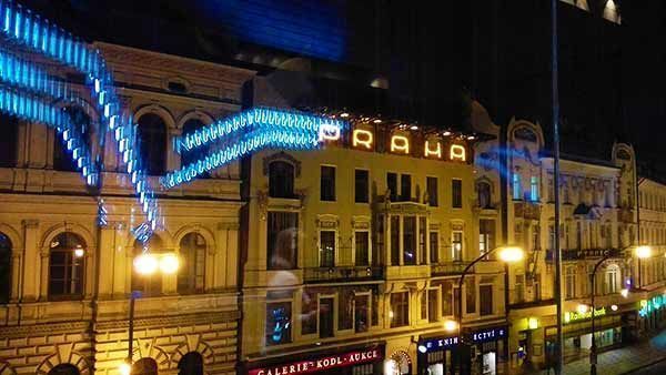 Sign Praha in mirror with blue neon light