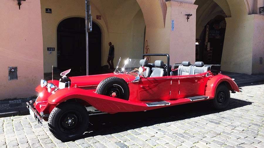 Drive in a red vintage car in Prague